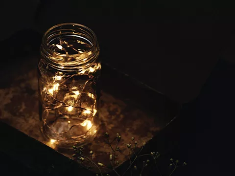A glass jar with fairy lights
