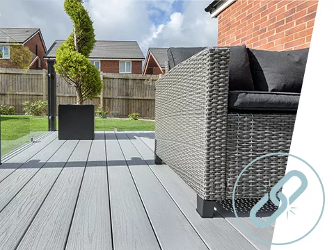 A grey UPVC deck with a sofa area