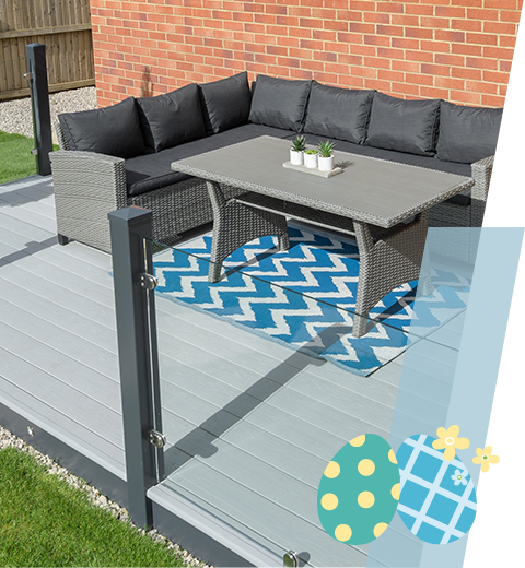 Grey decking with a table and sofa